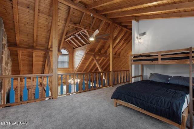 unfurnished bedroom with vaulted ceiling with beams, carpet floors, and wooden ceiling