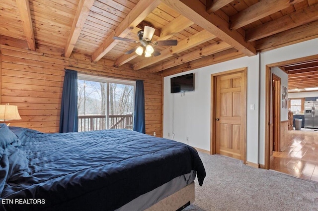 carpeted bedroom featuring access to outside, ceiling fan, wooden walls, and wood ceiling