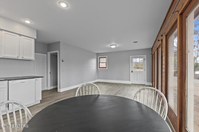 unfurnished dining area with light hardwood / wood-style floors