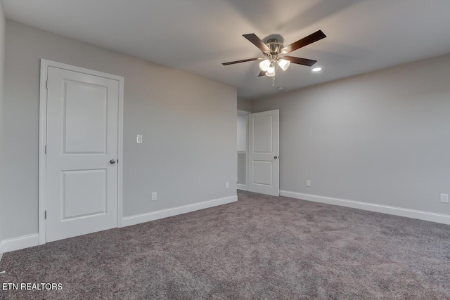 unfurnished room with carpet flooring and ceiling fan