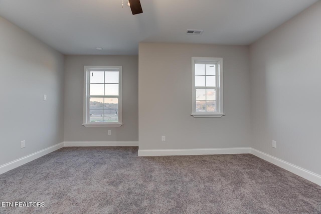 carpeted empty room with ceiling fan