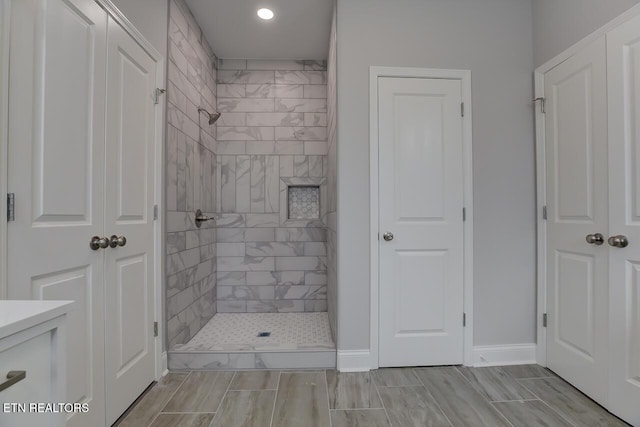 bathroom with tiled shower