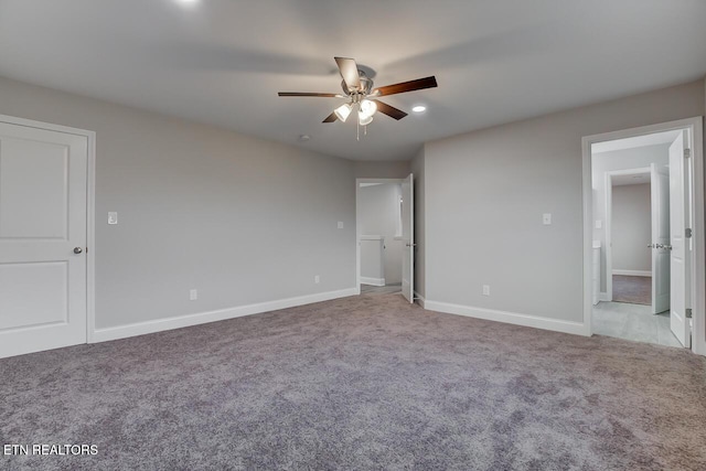 unfurnished bedroom featuring ceiling fan and light carpet