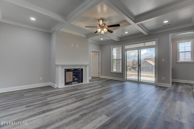 unfurnished living room with beam ceiling, a fireplace, and coffered ceiling