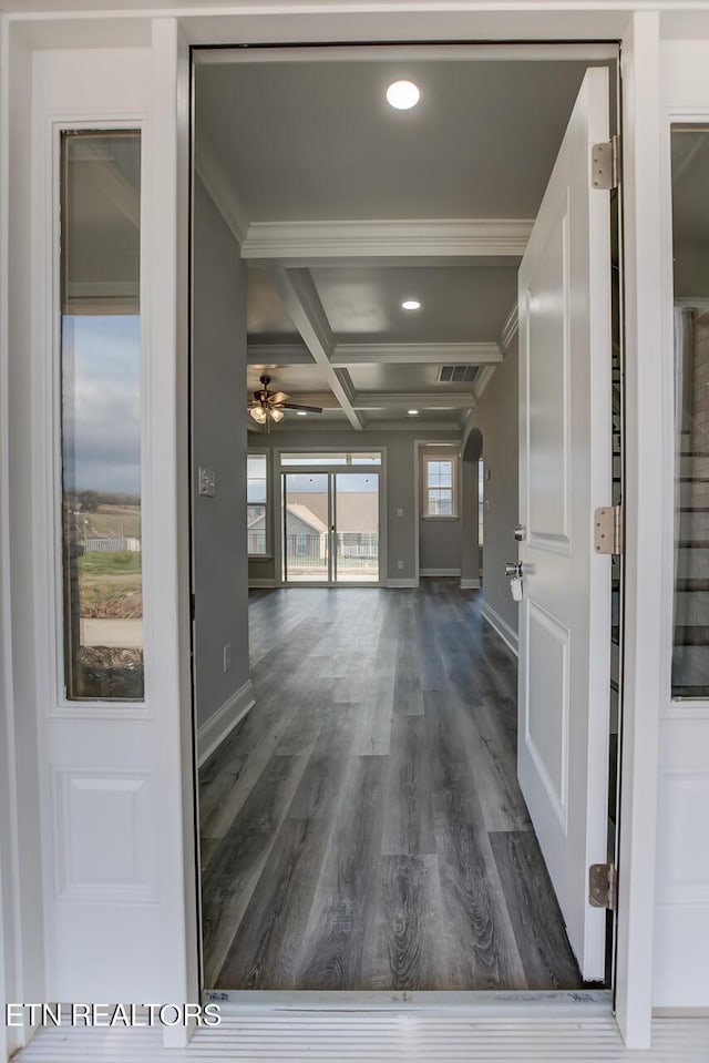 hallway with beamed ceiling, dark hardwood / wood-style flooring, crown molding, and coffered ceiling