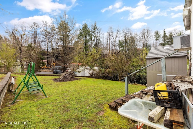 view of yard featuring central AC unit