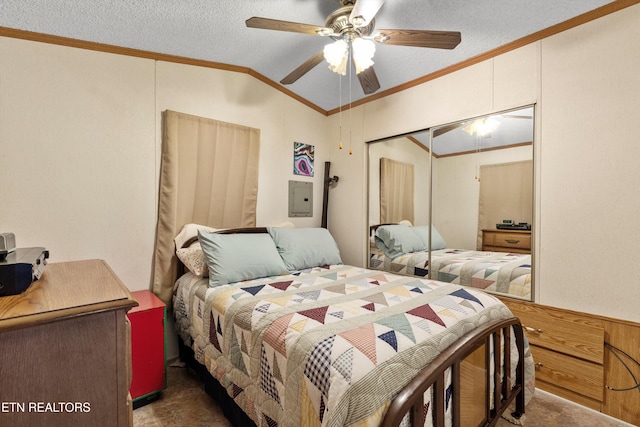 bedroom with a textured ceiling, a closet, ceiling fan, and crown molding