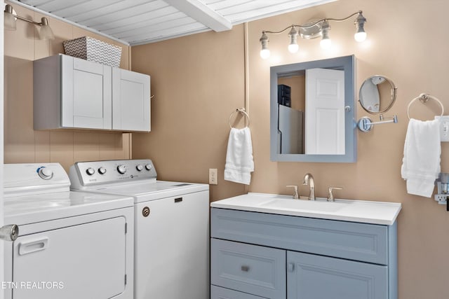 laundry room featuring independent washer and dryer and sink