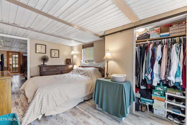 bedroom featuring light hardwood / wood-style floors and a closet