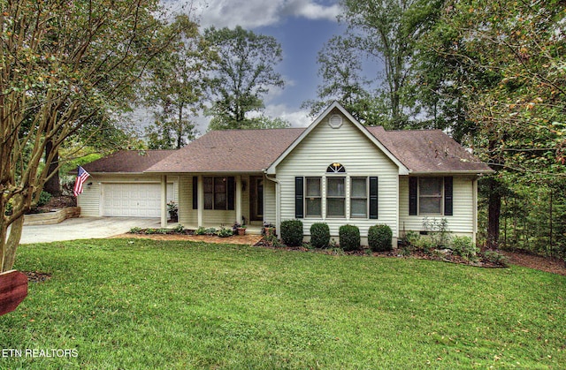 ranch-style home featuring a front lawn and a garage