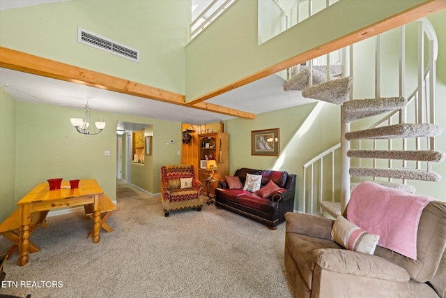 living room featuring light carpet, a high ceiling, and an inviting chandelier