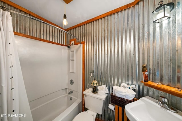 full bathroom with crown molding, sink, shower / bathtub combination with curtain, and toilet