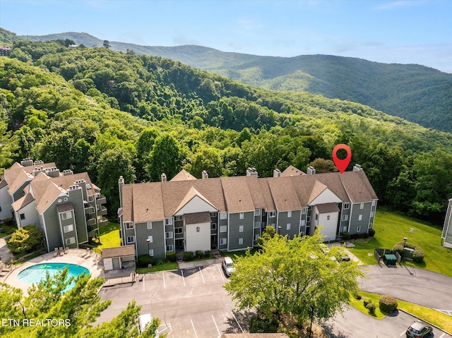 birds eye view of property with a mountain view