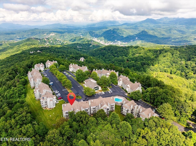 birds eye view of property with a mountain view