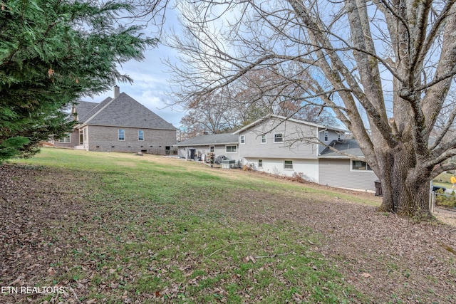 exterior space with a yard