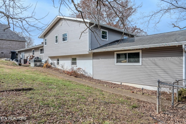 view of property exterior with a yard