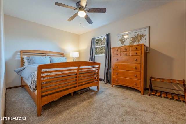 bedroom with light carpet and ceiling fan