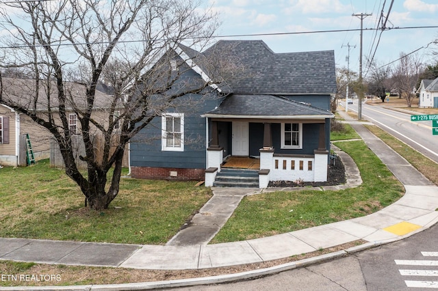 bungalow-style house with a porch and a front yard