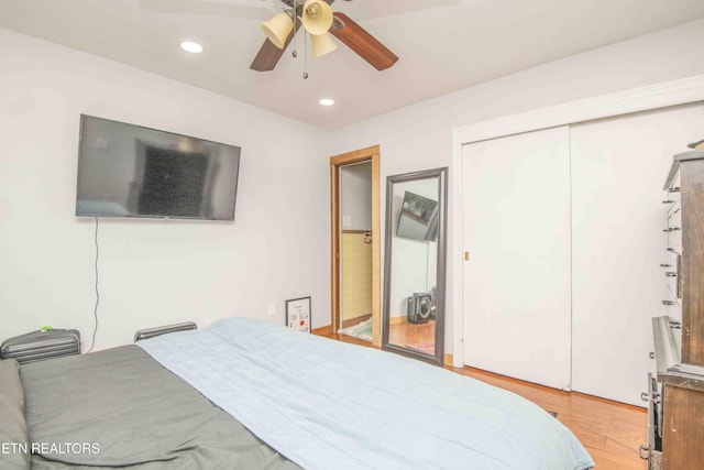 bedroom featuring light hardwood / wood-style flooring and ceiling fan