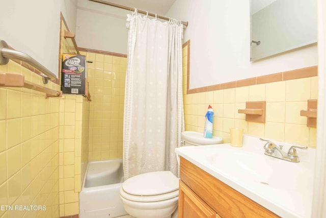 full bathroom with vanity, toilet, tile walls, and shower / tub combo with curtain