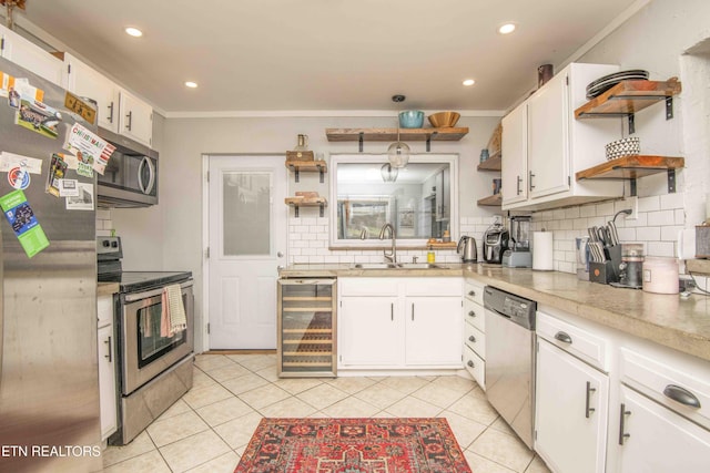 kitchen featuring white cabinets and appliances with stainless steel finishes