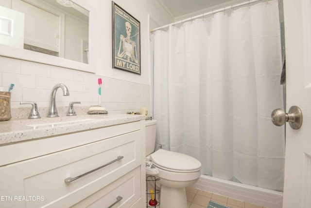 bathroom with vanity, a shower with curtain, crown molding, decorative backsplash, and tile walls