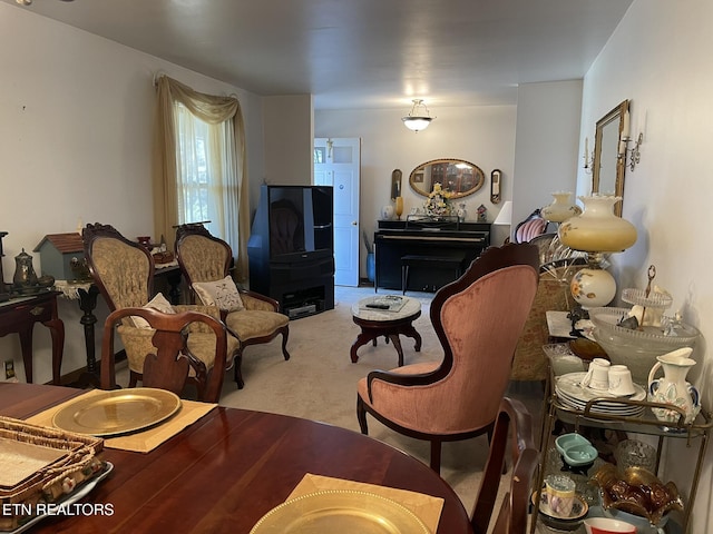 sitting room with light colored carpet