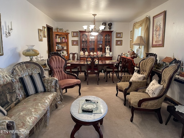 living room with an inviting chandelier and light colored carpet