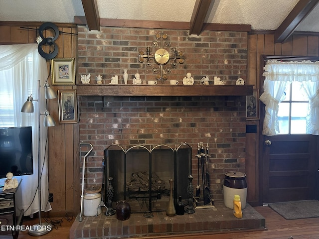 details with beamed ceiling, a brick fireplace, hardwood / wood-style floors, and wood walls