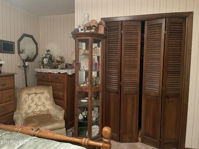 sitting room featuring light colored carpet