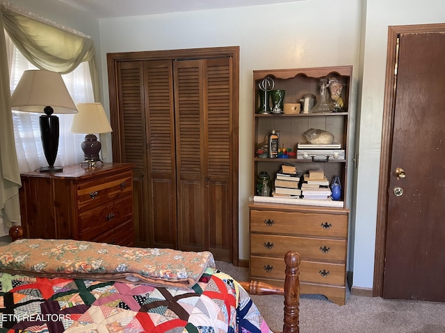 carpeted bedroom featuring a closet