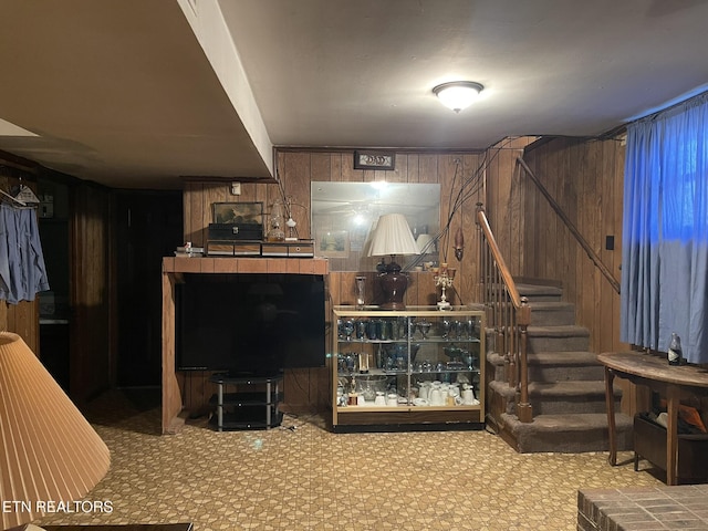 living room featuring wood walls