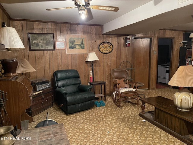 living room with wooden walls and ceiling fan