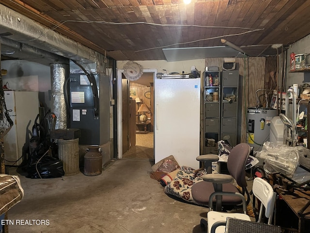 basement featuring white refrigerator, wooden ceiling, and water heater