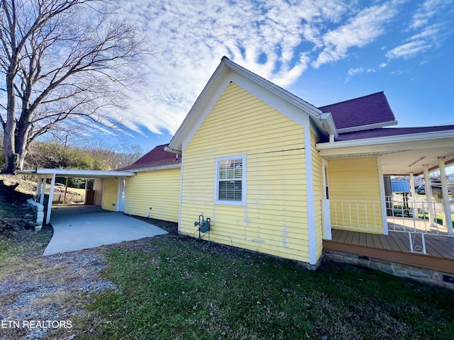 view of side of property with a patio area