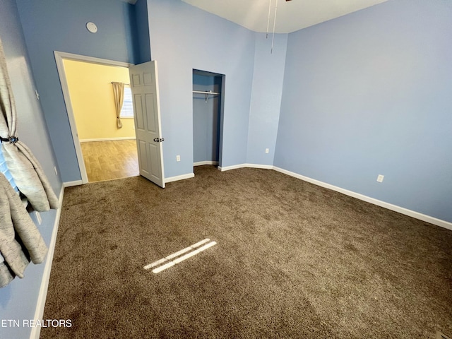 unfurnished bedroom with carpet floors and a closet