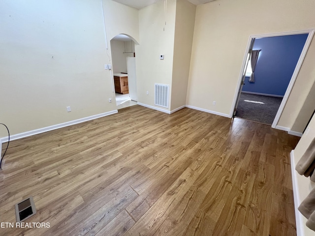 unfurnished living room featuring light hardwood / wood-style flooring