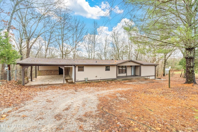 view of front of home with a carport