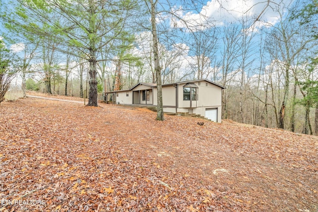 view of property exterior featuring a garage