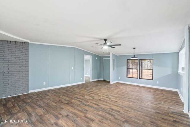 unfurnished room featuring ceiling fan, dark hardwood / wood-style flooring, crown molding, and vaulted ceiling