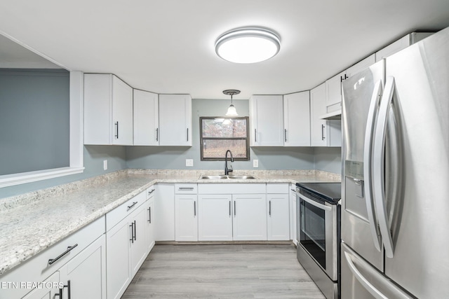 kitchen featuring white cabinetry, sink, and stainless steel appliances