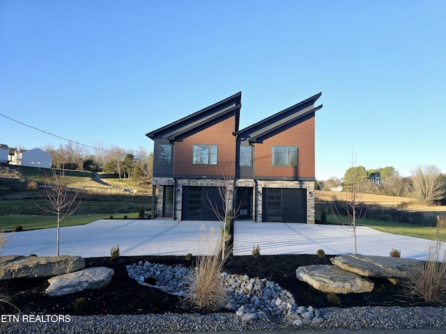 back of property with a garage