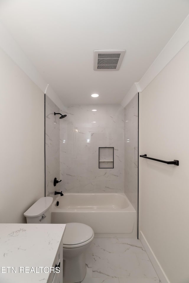 full bathroom with vanity, toilet, and tiled shower / bath