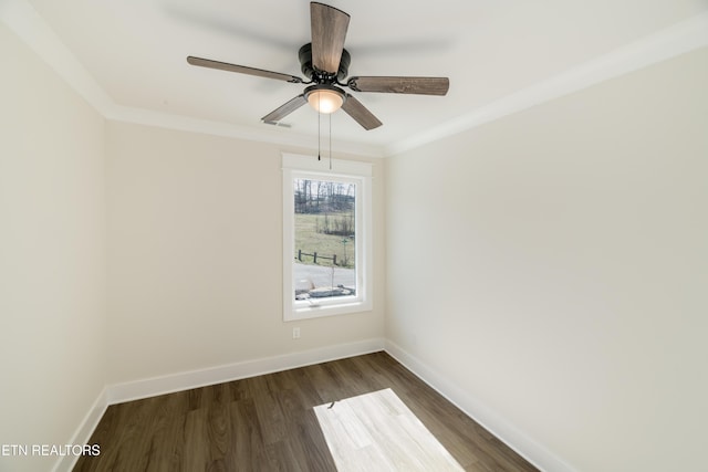 spare room featuring ceiling fan, ornamental molding, and dark hardwood / wood-style flooring