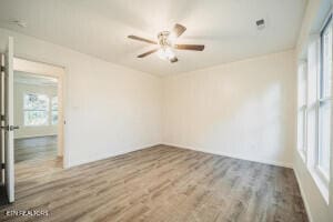 spare room featuring hardwood / wood-style flooring and ceiling fan