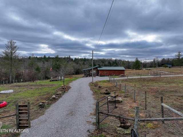 exterior space with a rural view and an outbuilding