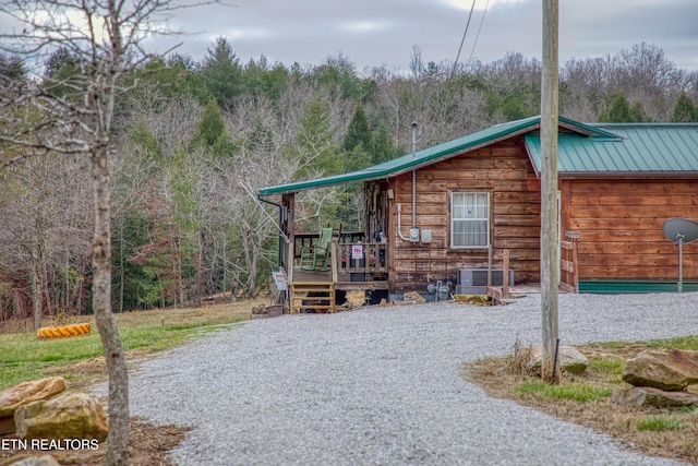 view of home's exterior with cooling unit and a deck