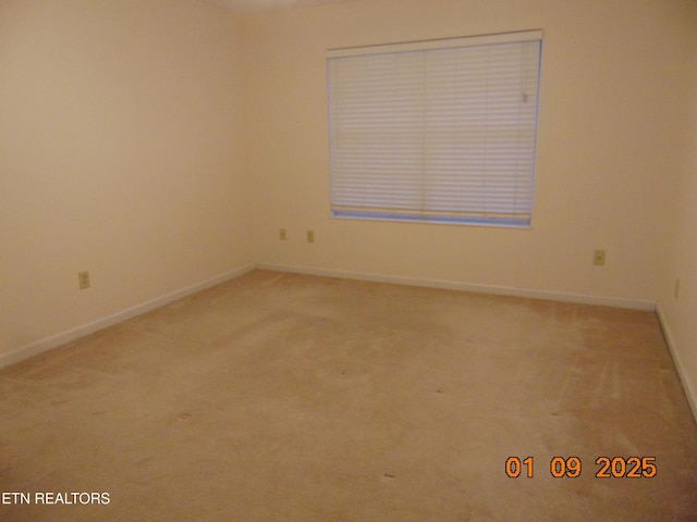 empty room with carpet flooring