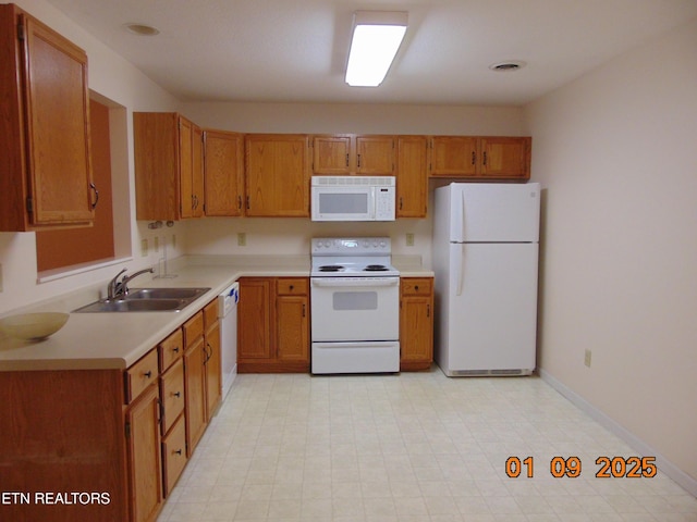 kitchen with white appliances and sink