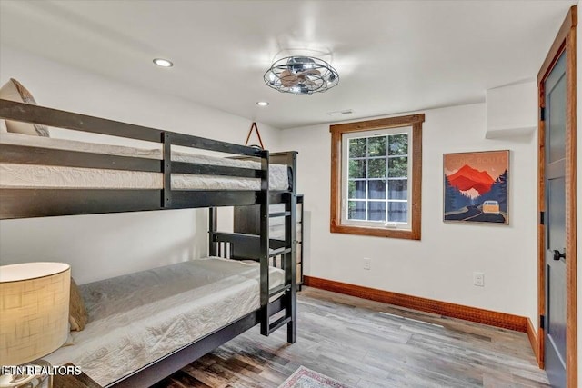 bedroom with wood-type flooring